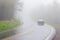 Car Disappears Into Dense Smoky Mountain Fog With Copy Space