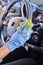 Car disinfecting service. Cleansing car interior and spraying with disinfection liquid