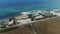 Car drive through the field near the sea in Italy drone flight 4k