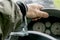 Car driver hand handcuffed to steering wheel, arrest, driving ban