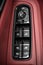 Car Driver`S And Passenger`S Front And Rear Windows control panel Switches in red leather car interior