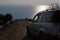 The car drives down the Bozburun mountain on a dirt road against the backdrop of the Mediterranean Sea