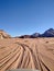 Car drives through Wadi Rum desert in Jordan