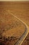 Car driving along desert road outback Australia