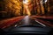 Car driving in Autumn woods with beautiful Fall foliage colors. Autumn seasonal concept.
