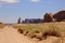 Car driving away in Monument Valley