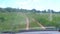 Car driving on country road on nature, view from inside car through windshield.