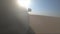 Car is driving in the desert. Camera from the car`s right side