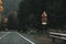 Car driving on an empty road surrounded by colorful trees in the Transfagarasan mountains in Romania