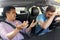 Car driving instructor talking to man failed exam