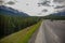 Car driving on a mountain road in the Canadian Rockies.Alberta, Canada, Montain scenic landscape. Tourism in summer