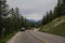 Car driving on a mountain road in the Canadian Rockies.Alberta, Canada, Montain scenic landscape. Tourism in summer