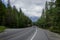 Car driving on a mountain road in the Canadian Rockies.Alberta, Canada, Montain scenic landscape. Tourism in summer