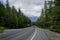 Car driving on a mountain road in the Canadian Rockies.Alberta, Canada, Montain scenic landscape. Tourism in summer