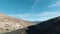 Car Driving on Road on Sunny Day in Death Valley National Park. California, USA