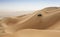 Car driving in Rub al Khali Desert at the Empty Quarter, in Abu