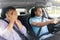 Car driving school instructor and male driver