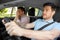 Car driving school instructor and male driver