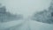 Car driving on snow road during strong snowfall in slowmotion. 1920x1080