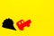 Car emitting dirty smoke. Pollution concept. Car and smoke cutout on yellow background top view copy space