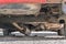 Car exhaust, muffler fallen down - view of chassis of a car