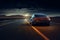 Car on the expressway, close-up. A modern car speeds along the evening highway at sunset. A fast sports car drives in the