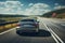 Car on the expressway, close-up. A modern car speeds along the evening highway at sunset. A fast sports car drives in the