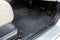 Car floor mats of black carpet with gas pedals and brakes in the workshop for the detailing vehicle after dry cleaning