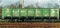 A car, a freight train, standing on the railway tracks