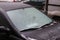 Car frozen windscreen and windscreen wipers after freezing rain