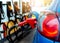 Car fueling at gas station. Refuel fill up with petrol gasoline. Petrol pump filling fuel nozzle in fuel tank of car at gas