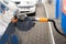 car fueling petrol at station