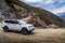 A car going down a mountain road from the Katu-Yaryk pass to the valley of the Chulyshman river