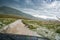 Car going on the muddy road after storm with hailstones in mountain near Lukomir, Bosnia and Herzegovina