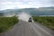 Car at gravel road Kolyma highway at Russian outback