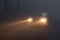 Car headlight beams in dense mist