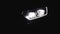 Car with Headlight Flashing Smoothly Close up. Car Front Led Light with a Blurry Background. Car Headlights Flashing Led