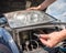 Car headlight repair by replacing bad bulbs with new ones