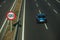 Car on highway and SPEED LIMIT signpost in Madrid