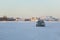 Car on Ice Road Yellowknife Skyline in Background