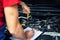 Car inspection and maintenance - mechanic check engine oil level