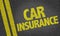 Car Insurance written on the road