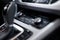 Car interior. Modern car illuminated dashboard. Luxurious car instrument cluster. Close up shot of automobile instrument panel