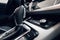 Car interior. Modern car illuminated dashboard. Luxurious car instrument cluster. Close up shot of automobile instrument panel.