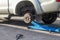 Car jack to lift up pickup truck for remove tire