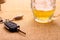 Car key with accident and beer mug