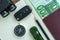 Car key, compass, pencil with passport, euro banknote on paper n