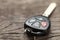 Car keys with remote control alarms on wooden background.