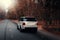 Car Land Rover Range Rover Sport drive on asphalt road at autumn forest