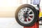 Car maintenance and service center. Vehicle tire repair and replacement equipment. Seasonal tire change